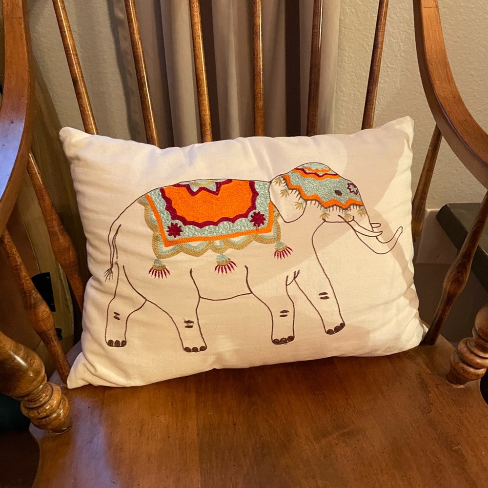 Adorable embroidered elephant pillow. The cover can be removed (zipper) to clean